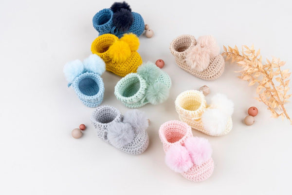 Topsy faux fur pom pom bootes